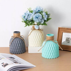 display of 3 vases, gray, white, teal